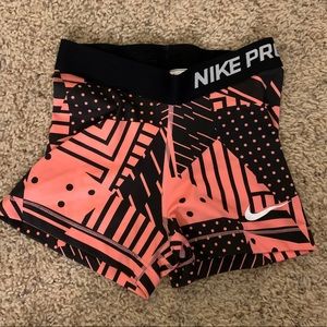 Pink and black nike pro spandex shorts